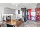 Contemporary kitchen featuring stainless steel appliances and a dark wood breakfast bar at 4381 W Flamingo Rd # 38303, Las Vegas, NV 89103