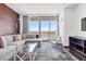 Inviting living room featuring city views, a gray sectional sofa, and stylish decor at 4381 W Flamingo Rd # 38303, Las Vegas, NV 89103
