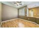 Bedroom with laminated floors, neutral walls and a large window with plantation shutters at 4956 Momenti St, Las Vegas, NV 89135