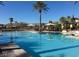 Inviting community pool with umbrellas and lounge chairs at 4956 Momenti St, Las Vegas, NV 89135