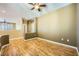 Empty room with hardwood floors, neutral paint, and modern outlets, ready for customization at 4956 Momenti St, Las Vegas, NV 89135
