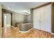 Hallway with laminate floors leading to secondary rooms and closet at 4956 Momenti St, Las Vegas, NV 89135