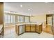 Kitchen with stainless steel appliances, countertop seating, and recessed lighting at 4956 Momenti St, Las Vegas, NV 89135