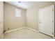 Laundry room featuring tiled floor and a window at 4956 Momenti St, Las Vegas, NV 89135