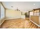 Spacious living room featuring an open layout with hardwood floors and modern lighting at 4956 Momenti St, Las Vegas, NV 89135