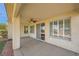 Covered patio area with ceiling fan, concrete flooring, and sliding glass door at 4956 Momenti St, Las Vegas, NV 89135