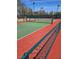 View of community tennis court with green and red surface and netting at 4956 Momenti St, Las Vegas, NV 89135