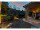 An elegant backyard featuring stone flooring, a landscaped garden with rocks and outdoor lighting at 5 Circa De Montanas, Henderson, NV 89011