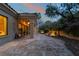 An elegant backyard featuring stone flooring, outdoor lighting and a professionally landscaped garden at 5 Circa De Montanas, Henderson, NV 89011