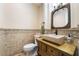 Charming powder room featuring a vessel sink with an antique vanity and decorative mirror and tile work at 5 Circa De Montanas, Henderson, NV 89011