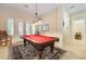 Bright game room with pool table, shutters and neutral colors in desirable home at 5 Circa De Montanas, Henderson, NV 89011