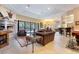 Expansive living room with fireplace, plush seating, and outdoor access at 5 Circa De Montanas, Henderson, NV 89011