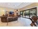 Bright living room with a fireplace, sliding glass doors, and comfortable furnishings at 5 Circa De Montanas, Henderson, NV 89011