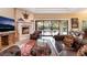 Beautifully decorated living space featuring a fireplace and an outdoor view at 5 Circa De Montanas, Henderson, NV 89011