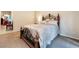 Comfortable main bedroom with a wrought iron bed frame and neutral walls and carpeting at 5 Circa De Montanas, Henderson, NV 89011