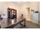 Dedicated home office featuring a large desk, built-in bookshelves and neutral walls and carpet at 5 Circa De Montanas, Henderson, NV 89011