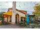 Cozy outdoor cafe seating area featuring charming architecture, and a pleasant atmosphere for dining and socializing at 5 Circa De Montanas, Henderson, NV 89011