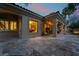 An elegant patio featuring stone flooring with outdoor lighting to create a relaxing ambiance at 5 Circa De Montanas, Henderson, NV 89011