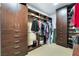 Spacious walk-in closet with custom shelving, cabinets, drawers, and ample storage space at 5 Circa De Montanas, Henderson, NV 89011