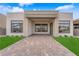 Exterior backyard with patio, lawn, and view of the mountains at 5030 Sandline Court, Las Vegas, NV 89135