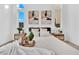 Bright bedroom featuring a comfortable bed, decorative artwork, and bedside tables with lamps at 5030 Sandline Court, Las Vegas, NV 89135