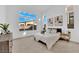 Serene bedroom featuring neutral tones, plush carpet, and large windows for lots of natural light at 5030 Sandline Court, Las Vegas, NV 89135