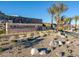 A stone sign that reads 'Ascension' with desert landscaping and palm trees at 5030 Sandline Court, Las Vegas, NV 89135