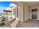 Inviting front porch with brick pavers, stone accents, and a modern front door creating a welcoming entry at 5030 Sandline Court, Las Vegas, NV 89135