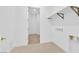 Clean laundry room features tile flooring, access to other rooms, and washer/dryer hookups at 5030 Sandline Court, Las Vegas, NV 89135