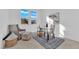 Bright home office features a desk, comfortable seating, and ample natural light, creating an ideal workspace at 5030 Sandline Court, Las Vegas, NV 89135