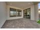 Covered patio with tile flooring and sliding glass doors at 5030 Sandline Court, Las Vegas, NV 89135