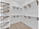 Well-organized walk-in closet features ample shelving and hanging rods, maximizing storage space at 5030 Sandline Court, Las Vegas, NV 89135