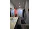 This bathroom features hardwood floors, neutral paint, and a walk-in laundry closet at 516 Sellers Pl, Henderson, NV 89011
