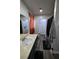 This bathroom features hardwood floors, neutral paint, and a walk-in laundry closet at 516 Sellers Pl, Henderson, NV 89011