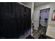 This bathroom features a modern shower curtain, hardwood floors, and neutral paint at 516 Sellers Pl, Henderson, NV 89011