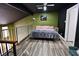 This bedroom features hardwood floors, a ceiling fan, and a cozy upstairs space at 516 Sellers Pl, Henderson, NV 89011