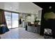 Bright kitchen features a breakfast bar, and a sliding door leading to a backyard at 516 Sellers Pl, Henderson, NV 89011