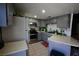 This kitchen has ample counter space, stainless steel appliances, and tile floors at 516 Sellers Pl, Henderson, NV 89011