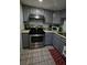 Updated kitchen showcasing stainless steel appliances and functional layout at 516 Sellers Pl, Henderson, NV 89011