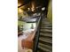 Living area with tiled floors, a balcony feature, stairs, and comfortable seating at 516 Sellers Pl, Henderson, NV 89011