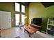 Bright living room featuring large windows, tile flooring, and modern decor at 516 Sellers Pl, Henderson, NV 89011