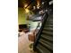 Living area with tiled floors, a balcony feature, stairs, and comfortable seating at 516 Sellers Pl, Henderson, NV 89011