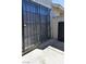 Private patio with a security gate and a stucco wall providing privacy at 516 Sellers Pl, Henderson, NV 89011