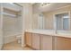 Well-lit bathroom with a full-length vanity and a shower-tub combination at 5245 Sand Dollar Ave, Las Vegas, NV 89141