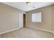 This is a clean and simple bedroom with a large window and a closet at 5245 Sand Dollar Ave, Las Vegas, NV 89141