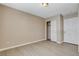 Bedroom with sliding door closet, neutral walls, and modern light fixture at 5245 Sand Dollar Ave, Las Vegas, NV 89141