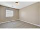 Cozy bedroom featuring a large window and neutral-toned walls and floors at 5245 Sand Dollar Ave, Las Vegas, NV 89141