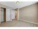 Spacious bedroom with en suite access, neutral walls, and modern light fixture at 5245 Sand Dollar Ave, Las Vegas, NV 89141