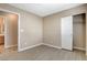 Bedroom featuring wood-look floors and an attached bathroom at 5245 Sand Dollar Ave, Las Vegas, NV 89141