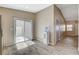 Bright dining area with sliding glass door to outdoor space and ceramic tile floors at 5245 Sand Dollar Ave, Las Vegas, NV 89141